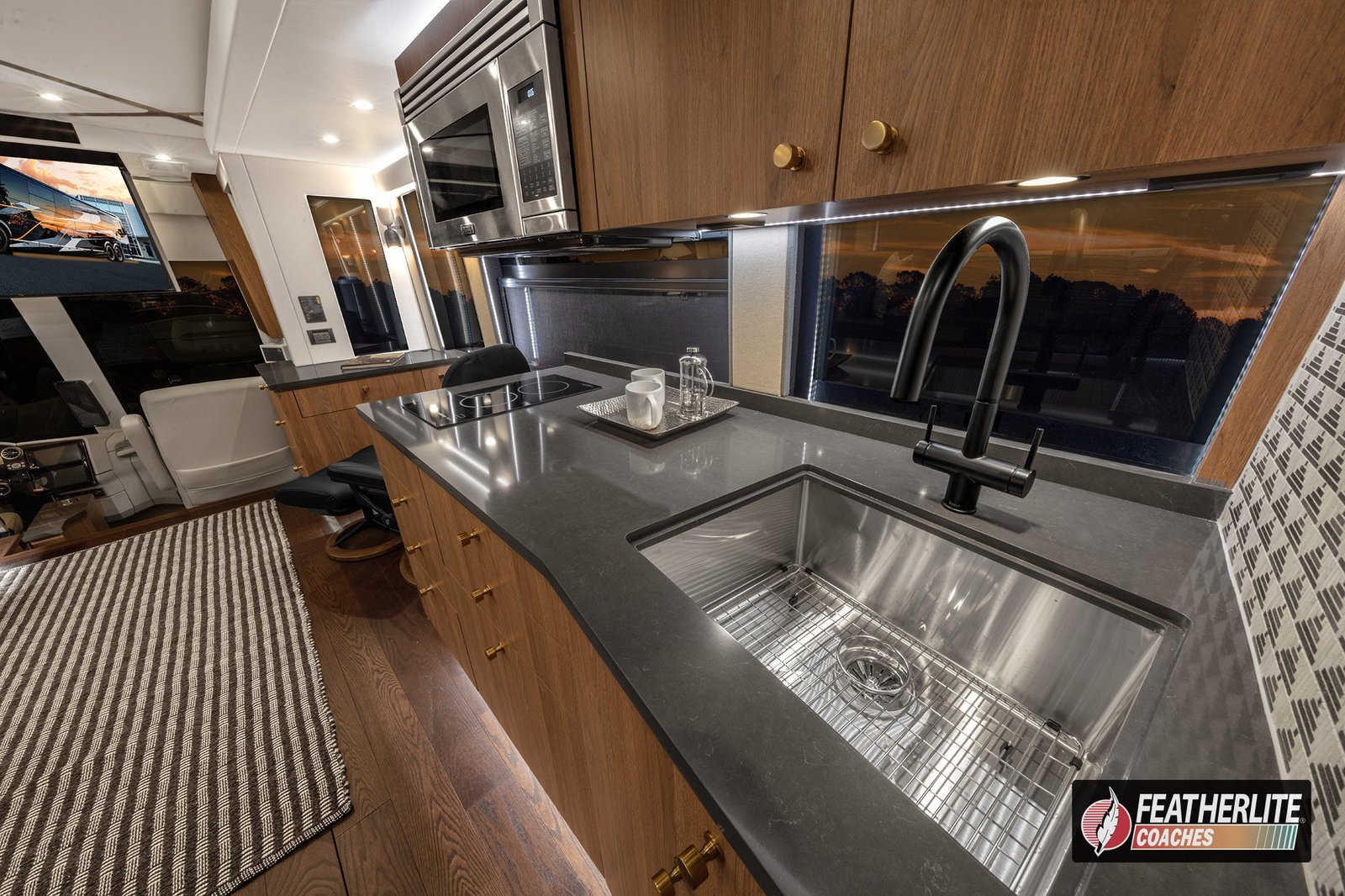 2026 Featherlite Prevost Durango | Gourmet galley in the Durango coach with Calypso Silestone counters and Viking appliances