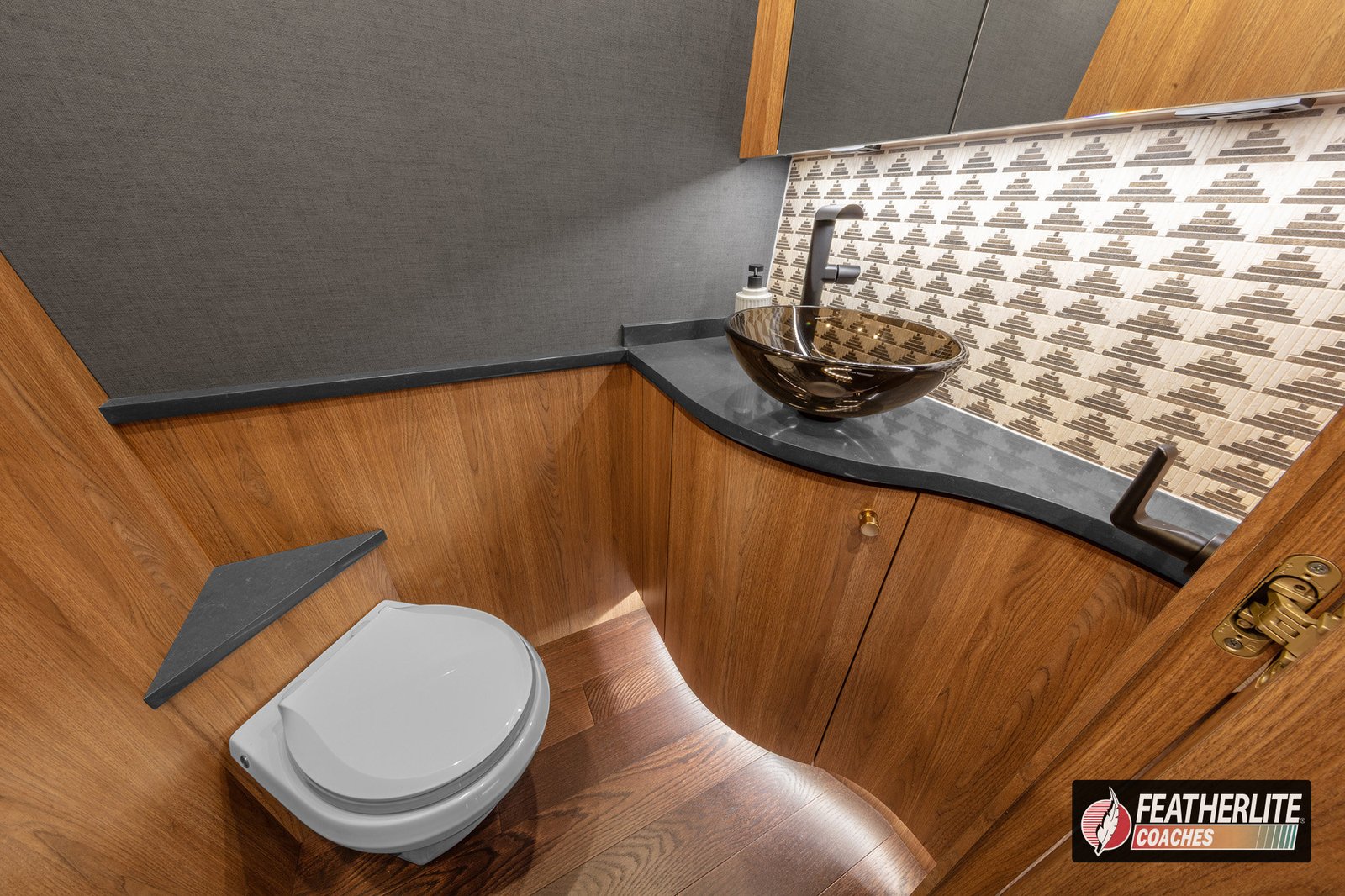 2026 Featherlite Prevost Durango | Powder room in Durango coach with designer tile and premium fixtures