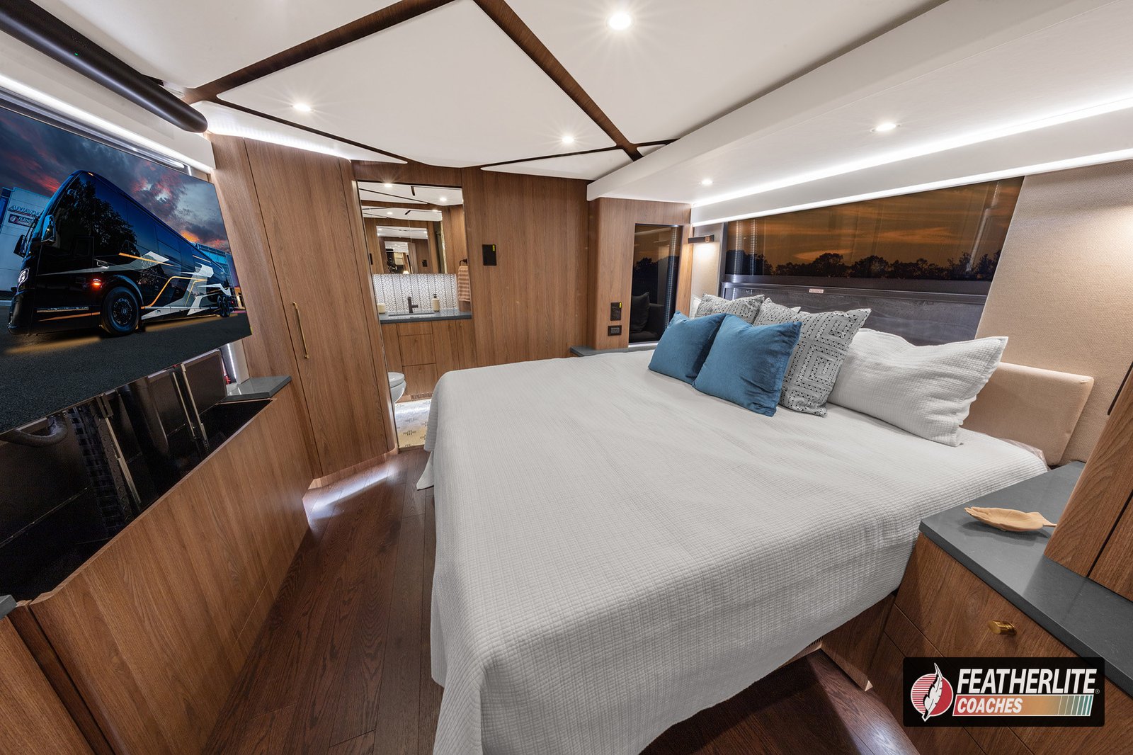 2026 Featherlite Prevost Durango | stateroom in Durango coach with super slide, backlit ceiling, and LG OLED TV