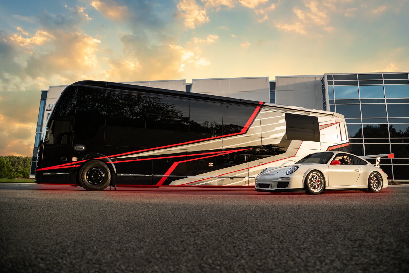 Exterior with Porsche GT3 | Coach 1819 | Featherlite Coaches Prevost